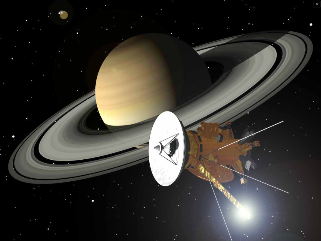 Fig. 2 - Rappresentazione artistica di Saturno con la sonda Cassini - Crediti: NASA/ESA/ASI