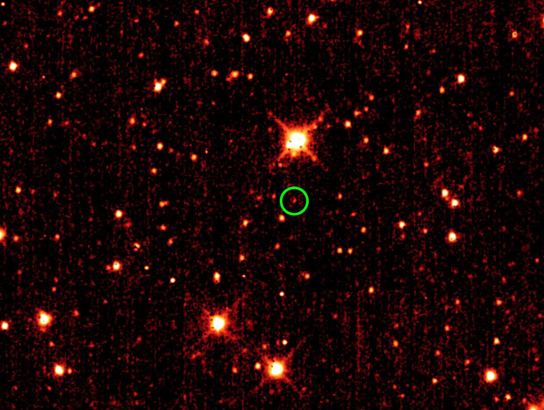 Fig. 3 - L’asteroide 2010 TK7 (cerchiato in verde, in basso a destra) in un’immagine ripresa dalla sonda WISE della NASA - Crediti: NASA.